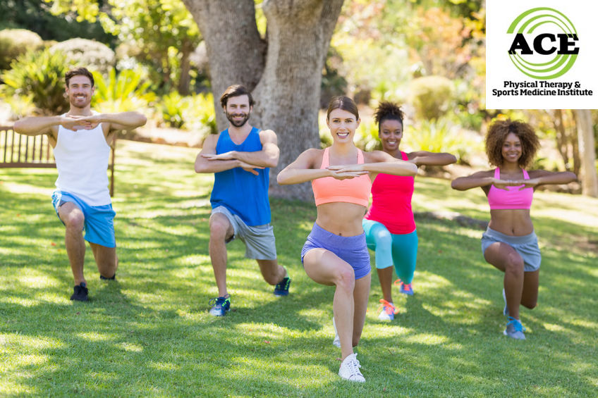 59100730 - group of friends exercising in park