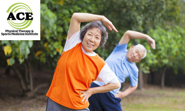 26569073 - senior couple doing exercise in the park.